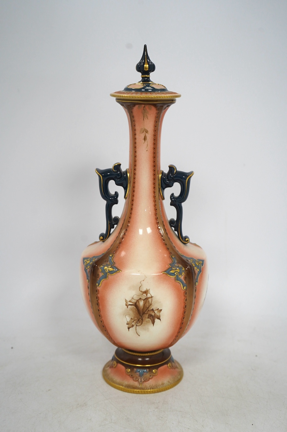 A Hadleys Worcester faience vase and cover, 31cm high. Condition - fair, the pommel on the lid has been broken and reattached